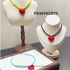 American Sweetheart matching heart necklaces in yellow, black and sky blue