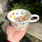 Close up handmade ceramic dog figurine on custom 3D pet mug