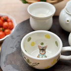 Close up handmade ceramic dog figurine on custom 3D pet mug