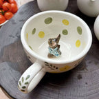 Personalized pet mug used for coffee with handmade ceramic dog design