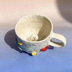 Close up handmade ceramic dog figurine on custom 3D pet mug
