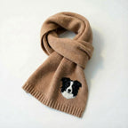 Close up of personalized pet portrait knitted scarf showing custom dog and cat face pattern