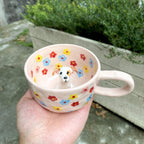 Close up handmade ceramic dog figurine on custom 3D pet mug