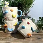 Personalized pet mug used for coffee with handmade ceramic dog design