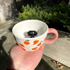 Close up handmade ceramic dog figurine on custom 3D pet mug