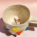 Close up handmade ceramic dog figurine on custom 3D pet mug